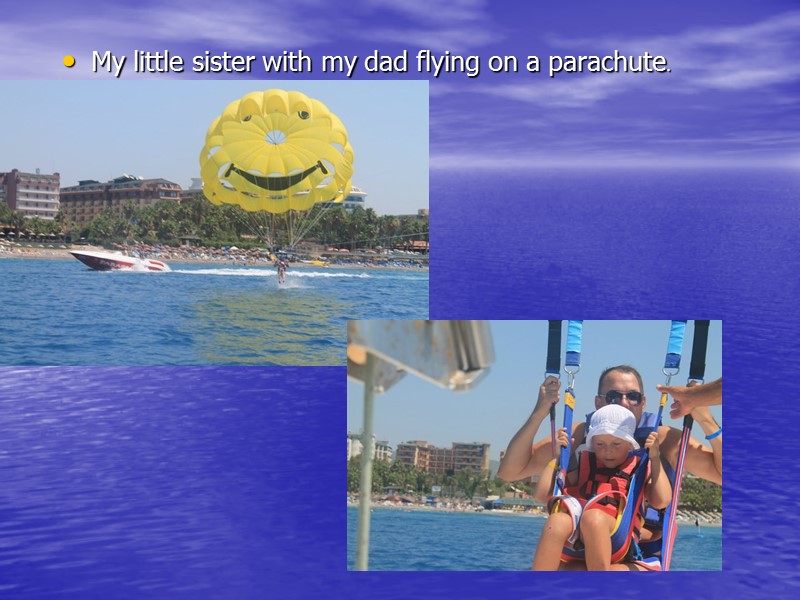 My little sister with my dad flying on a parachute.